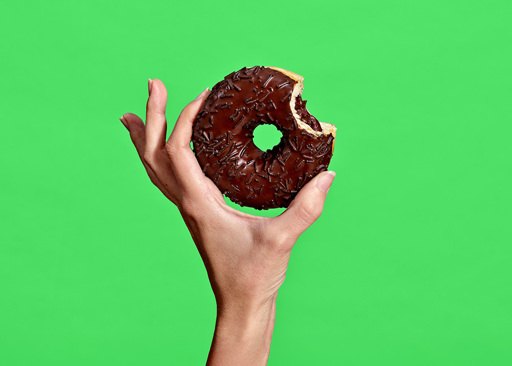 228293 Schulstad Chocolatey Filled Ring Donut with bite to reveal cocoa creme filling