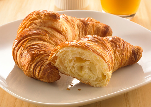 17911500 Schulstad Large All Butter Croissant Plated and Cut Open for Breakfast