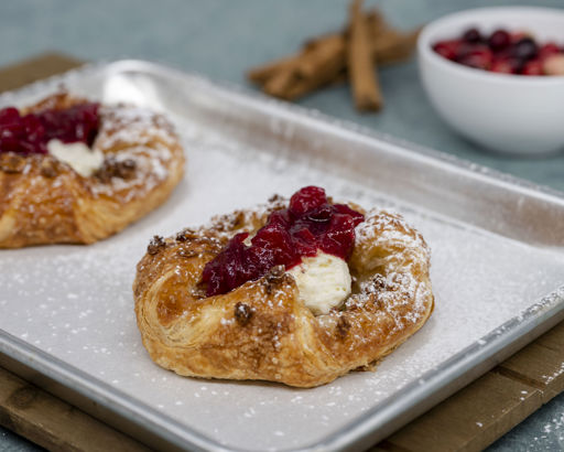 Schulstad Cranberry Apple Crown Seasonal Pastry Recipe with whipped cream cheese, cranberry compote, cinnamon crumble and powdered sugar