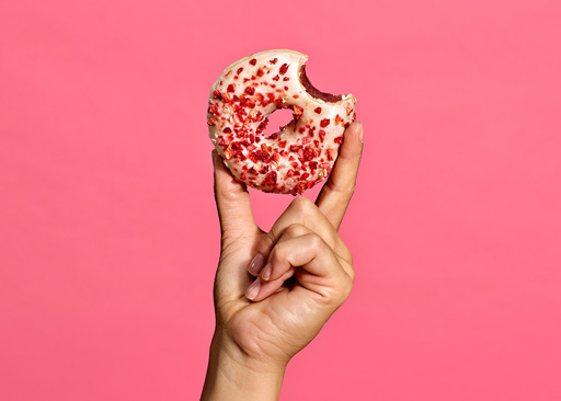228290 Schulstad Berries & Creme Filled Ring Donut with bite to reveal raspberry creme blend filling, reminiscent of panna cotta