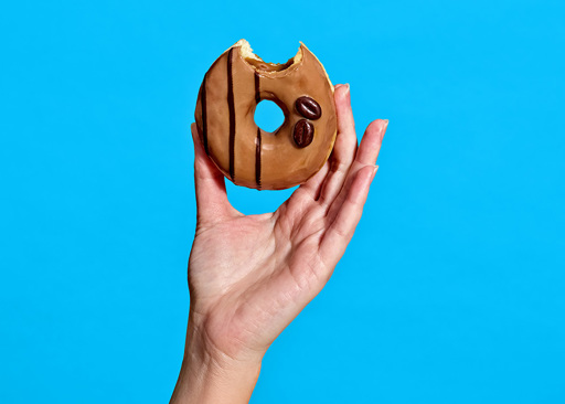 228287 Schulstad Cappuccino Filled Ring Donut with bite to reveal cappuccino creme filling